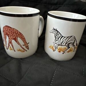 One zebra cup one giraffe cup
